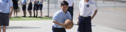 A young man playing basketball