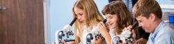 Academy learners peer into microscopes to learn about the tiny world of science