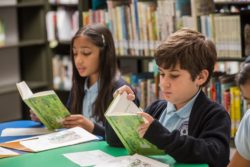 Children relax in a library and enjoy reading stories