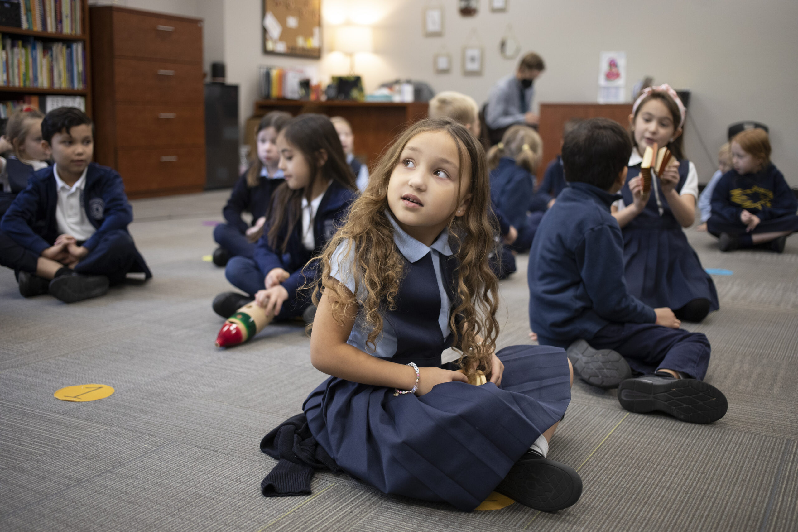 students on floor in class