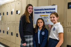 3 students in front of lockers